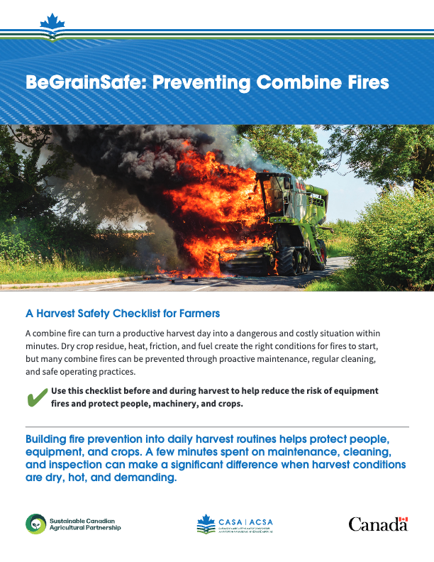 Farm equipment on fire during a controlled burn for crop safety.