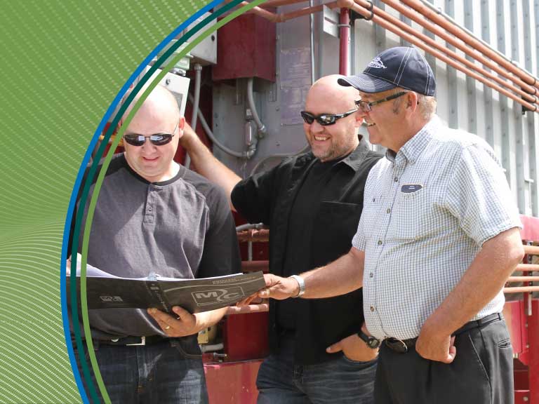 Ensuring safety on agricultural sites with workers reviewing safety protocols.