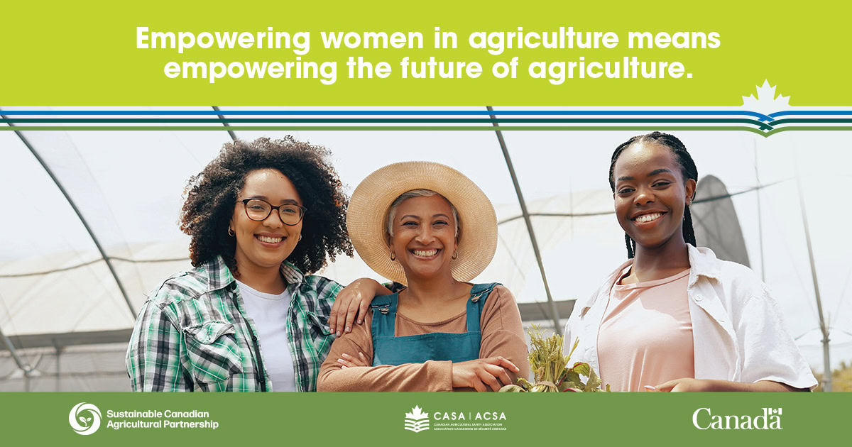 Three women in a greenhouse, smiling, representing women in agriculture.